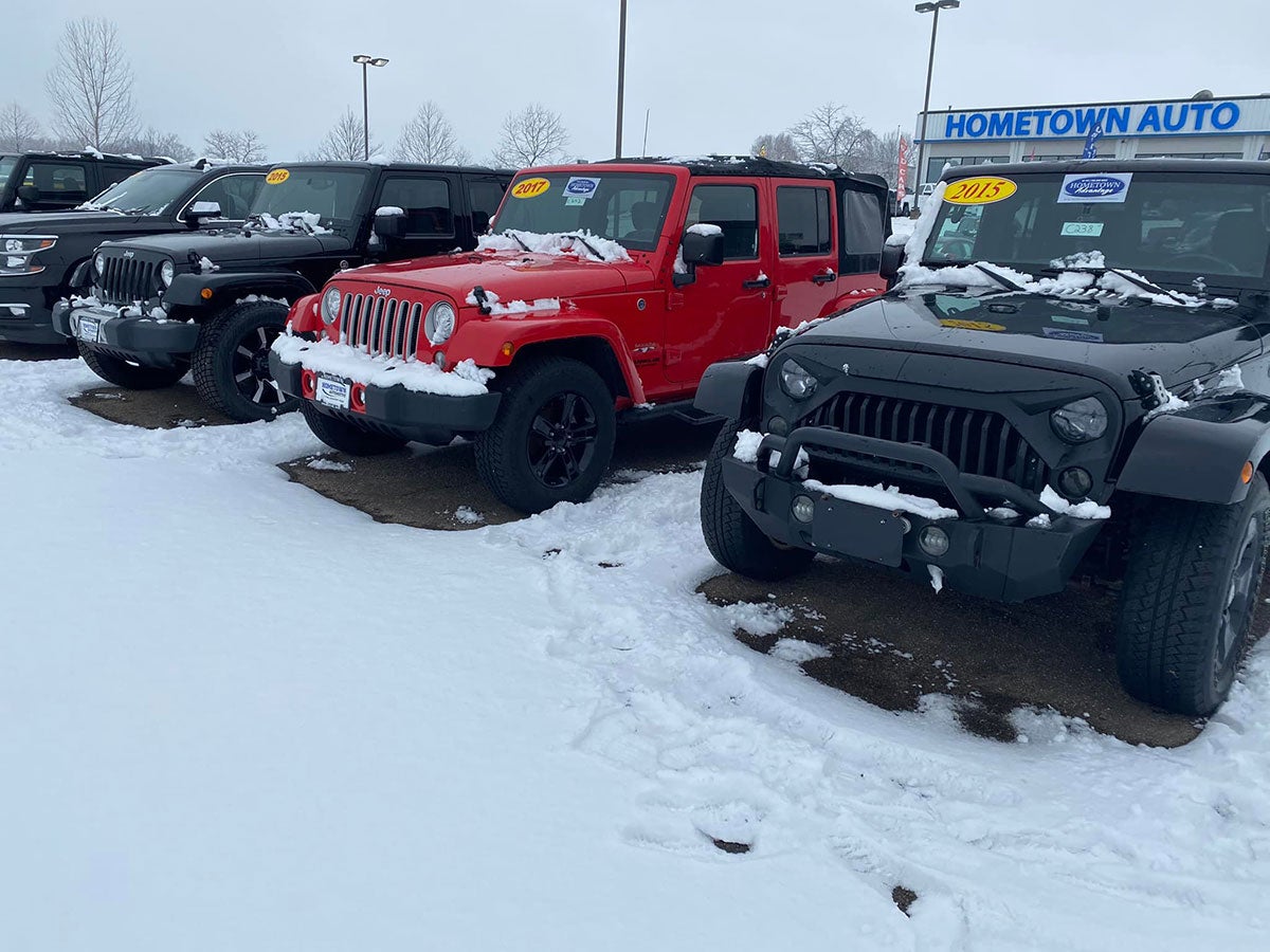 A line of snowy used Jeep Wranglers at our Chillicothe, OH dealership