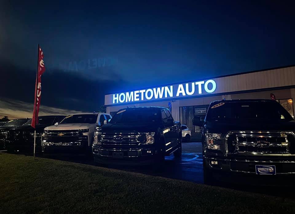 Trucks lined up at night in front of Your Hometown Auto in Chillicothe, OH